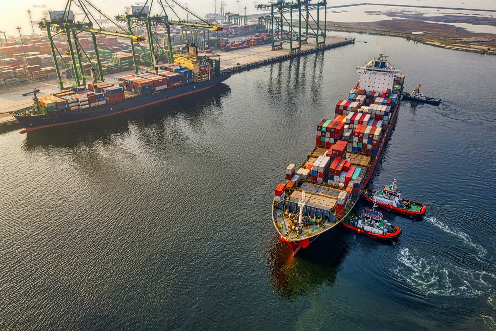 Container terminal cranes beside water